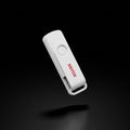 A high-resolution, centered image of a white Xerox USB license key on a pure black background.