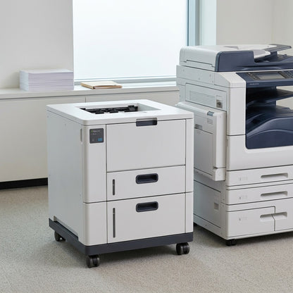 Xerox Oversize High Capacity Feeder on casters in a bright, modern office with a large multi-function printer and window background.