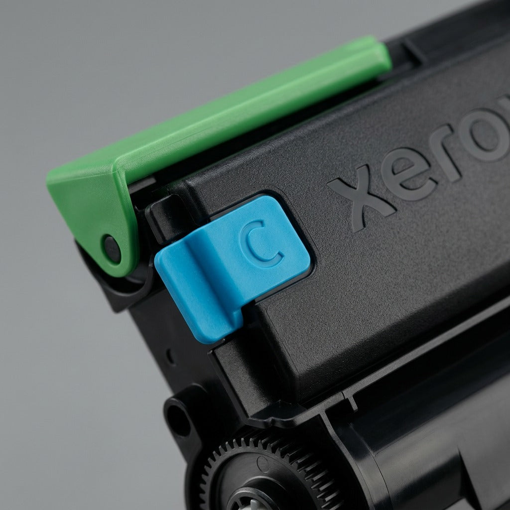 A detailed macro photograph focusing on the precision connector teeth and the cyan 'C' logo area of the Xerox 006R04357 toner cartridge.