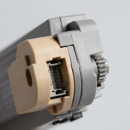 Macro view of the Xerox 106R01079 Yellow Toner, detailing its connector and gear mechanism.