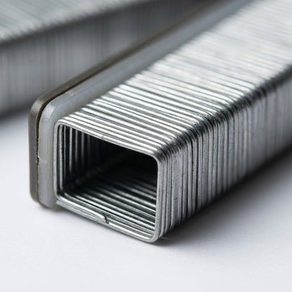 Extreme close-up macro view of the Xerox 008R12897 staple cartridge, showing a row of metal staples.