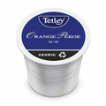 A high-resolution, centered photograph of a single Tetley Orange Pekoe K-Cup pod.