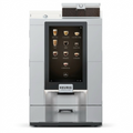 A high-resolution product shot of the stainless steel Keurig Eccellenza Momentum commercial coffee machine with its large touchscreen display.