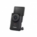 Canon PowerShot V10 vlogging camera angled view with stand deployed on white background.