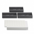 A close-up photograph of three grey rectangular toner cartridges.