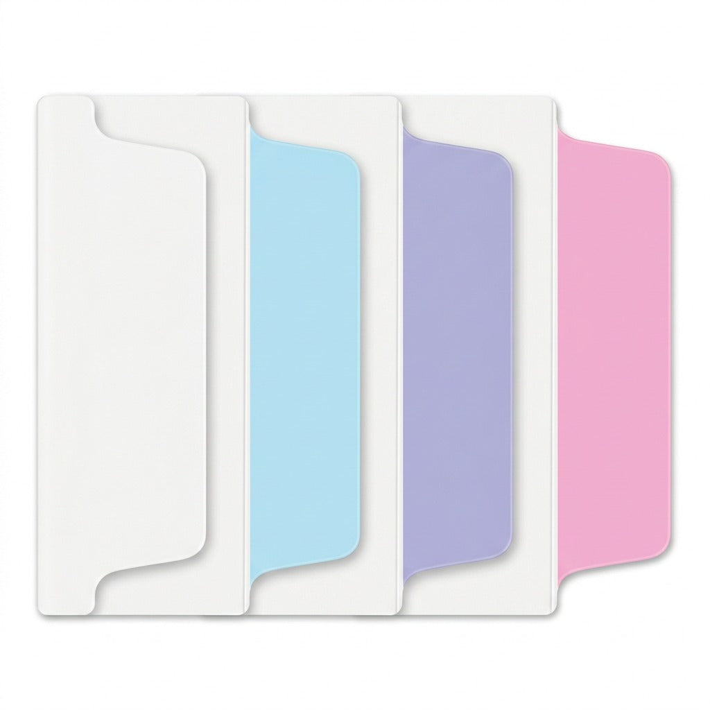 A high-resolution photograph of individual Avery UltraTabs in pastel blue, lavender, and pink, plus one all-white tab, neatly arranged against a pure white background. Each tab has a clear two-sided writeable area from the source material and is shown to realistic scale with sharp edges and realistic lighting. All packaging and text have been removed.