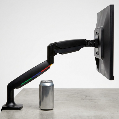 A standard beverage can and computer monitor provide scale reference for the Kensington single arm mount.