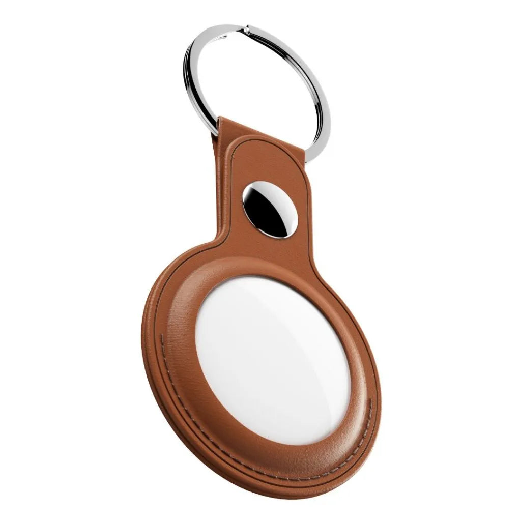 A brown leather keychain with an oval-shaped holder, a silver metal split ring, and a small black oval cutout, shown on a plain white background.